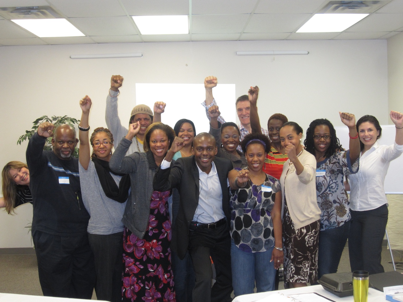 Participants celebrating together with raised fists