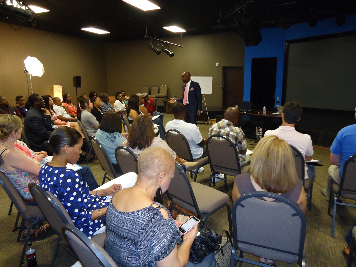 Participants seated and listening during a live session