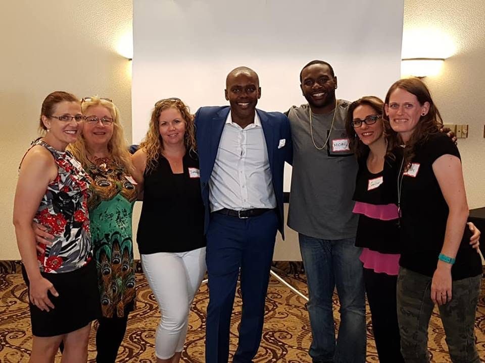Noel Walrond with a group of program participants
